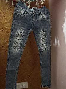 Distressed Denim Jeans with 'Girl' Graphic
