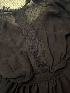 Elegant Black Sheer Blouse with Ruffle Detail
