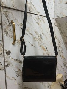 Shiny Black Clutch with Apple Embellishment