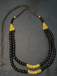 Black beads and golden finish costume jewellery