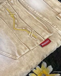 Stylish Beige Jeans with Graphic Print