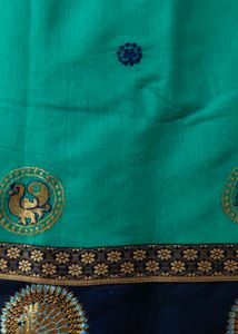 Elegant Teal Saree with Peacock Motif