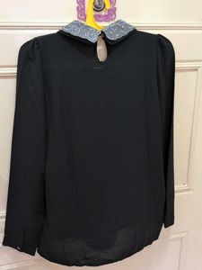 Chic Black Top with Embellished Collar