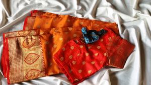 Elegant Orange Silk Saree with Golden Zari