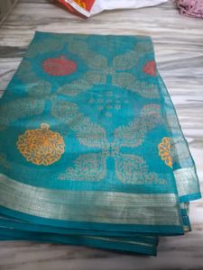 Beautiful Teal Saree with Golden Motifs
