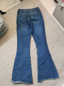 Blue Flare Jeans with Distressed Knee