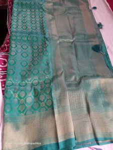 Beautiful semi kanjivaram Teal Saree with Gold Bro
