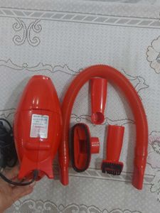 Red hand-held corded electric Vacuum Cleaner