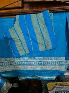 Vibrant Teal Saree with Striped Blouse