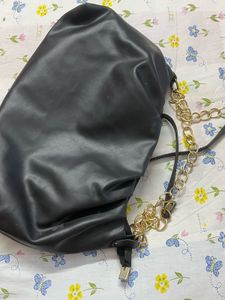 Chic Black Bag with Gold Chain Detail