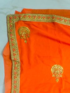 beautiful golden embroidery border orange saree