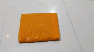 Elegant Orange Saree with Peacock Embellishments