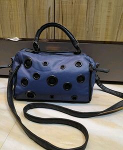 Stylish Blue Handbag with Eyelet Details