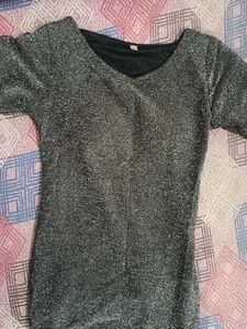 This is a grey stretch knit metallic long party dr