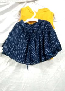 yellow top with navy blue skirt