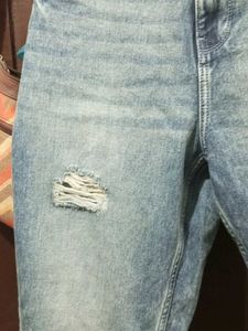 Distressed Blue Denim Jeans