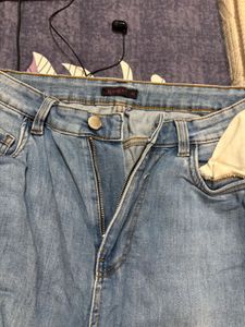 Distressed Blue Denim Jeans