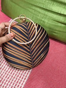 Round Leaf Print Clutch with Rhinestone Handle