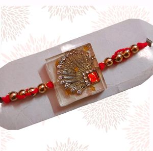 Glamorous Rakhi with Red & Gold Accents