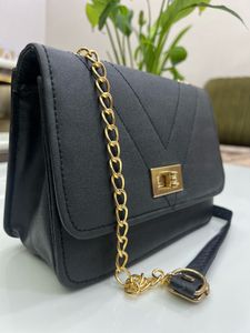 Chic Black Crossbody Bag with Chain Detail