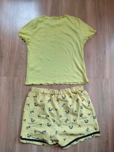 Only brand top with cute yellow shorts.