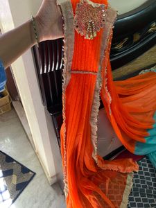 Stunning Blue and orange Net saree with Embellishm