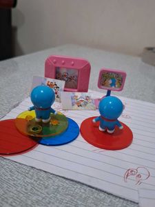 Cadbury doremon 2 figures , time tv and alb