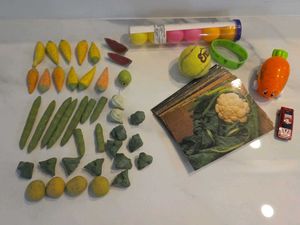 picture cards, toy cars, tennis ball, ceramic toys