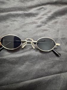 voyage black oval unisex sunglasses