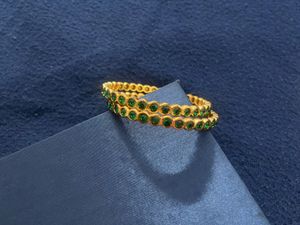 Gold Tone Bangles with Green Stones