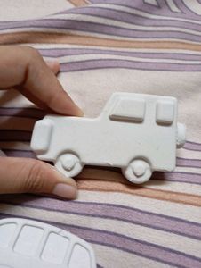 x3 pieces of concrete art cars