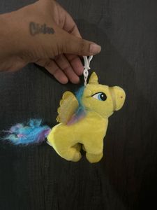small yellow plush unicorn