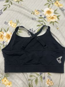 Black Sports Bra with 'RELIVE' Graphic