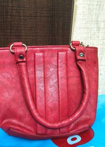 Maroon small handbag