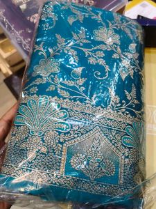 Elegant Teal Saree with Golden Motifs