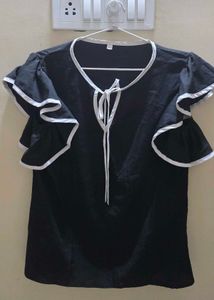 Elegant Black Top with White Accents