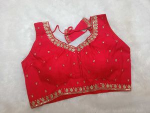 Sleeveless embroidered red blouse
