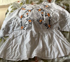 Embroidered White Peplum Top