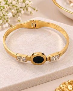 Elegant Gold Bangle with Black &amp; Crystal Accents