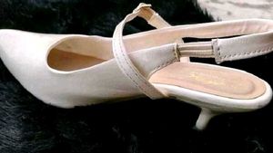 White Pointed Slingback Heels.