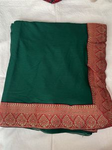 Elegant Green Saree with Red Border