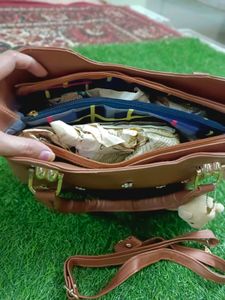 Elegant Brown Handbag with Floral Accents