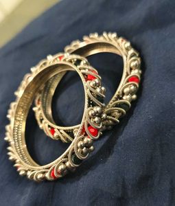 Silver tone Bangles: Red and green details.