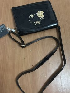 Shiny Black Clutch with Apple Embellishment