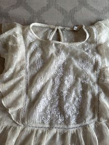 Elegant White Embroidered Peplum Top