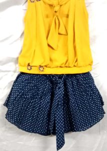 yellow top with navy blue skirt