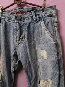 Distressed Light Wash Denim Jeans