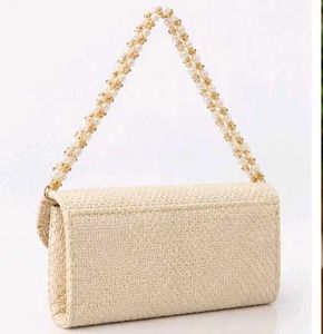 Elegant Woven Clutch Bag with Flower Detail