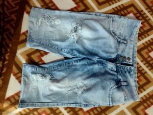 Ripped Blue Denim Capris