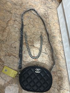 Black Quilted Oval Crossbody Bag